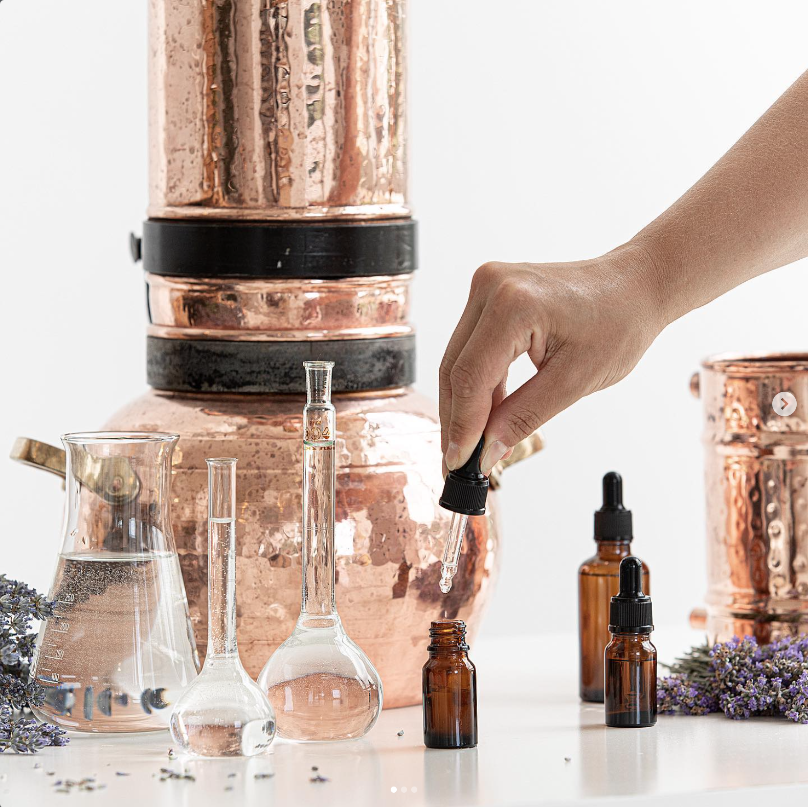 Copper still and essential oil bottles